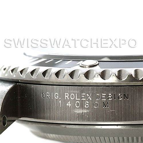 This close-up image shows the case side of a Rolex Submariner 14060 Men's Stainless Steel Black Dial 14060 Men's Stainless Steel Black Dial, including the engraved model number 14060M.