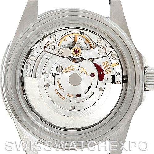 The image shows the back view of a Rolex Submariner 14060 Men's Stainless Steel Black Dial 14060 Men's Stainless Steel Black Dial watch, exposing its inner mechanical movement and components.