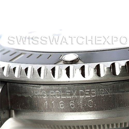 This image shows a close-up of the side of the Rolex Submariner 116610 Men's Stainless Steel Black Dial 116610 Men's Stainless Steel Black Dial, focusing on the bezel and engraved caseback.