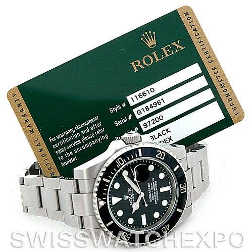 The image shows a Rolex Submariner 116610 Men's Stainless Steel Black Dial 116610 Men's Stainless Steel Black Dial watch at a slight angle from the left, along with its warranty card.