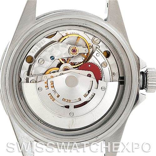 This image shows the movement mechanism of a Rolex Submariner 14060 Men's Stainless Steel Black Dial 14060 Men's Stainless Steel Black Dial watch from the back, highlighting its intricate internal components.