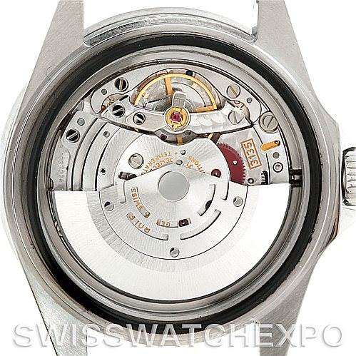 The image shows the back view of a Rolex Submariner 16610 Men's Stainless Steel Black Dial 16610 Men's Stainless Steel Black Dial watch, revealing its internal movement and mechanics.