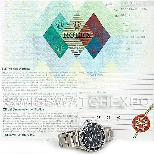 The image shows a Rolex Submariner 16610 Men's Stainless Steel Black Dial 16610 Men's Stainless Steel Black Dial watch laid flat with its bracelet extended, accompanied by its warranty and certification papers.