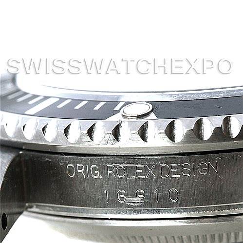A close-up side view of a Rolex Submariner 16610 Men's Stainless Steel Black Dial 16610 Men's Stainless Steel Black Dial showing the bezel and engraved details on the case.