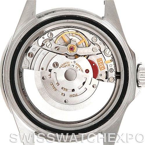 The image shows the internal movement parts of a Rolex Submariner 16610 Men's Stainless Steel Black Dial 16610 Men's Stainless Steel Black Dial watch viewed from the back case.