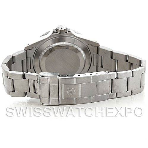 The image shows the rear view of a Rolex Submariner 16610 Men's Stainless Steel Black Dial 16610 Men's Stainless Steel Black Dial watch, focusing on the case back and the metal bracelet.