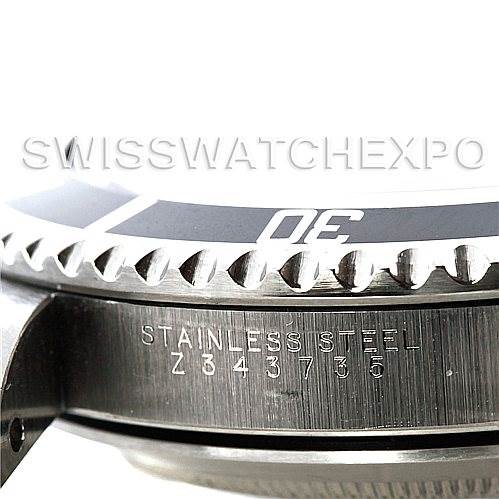This image shows a close-up side view of the bezel and case of a Rolex Submariner 14060 Men's Stainless Steel Black Dial 14060 Men's Stainless Steel Black Dial watch.