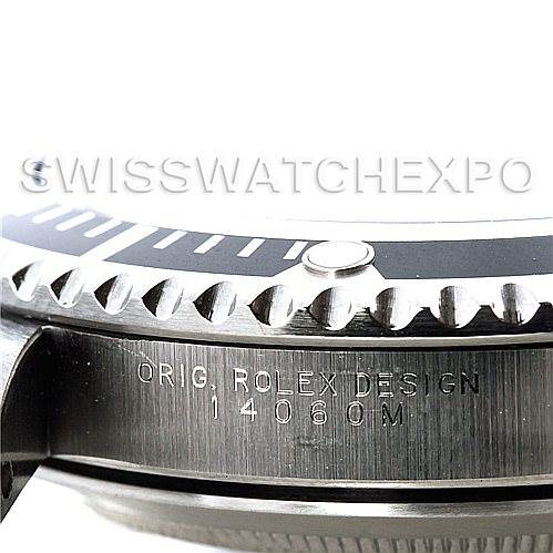 The image shows a close-up of the side and bezel of a Rolex Submariner 14060 Men's Stainless Steel Black Dial 14060 Men's Stainless Steel Black Dial watch, with "ORIG. ROLEX DESIGN 14060M" engraved.