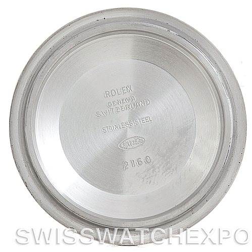 This is a view of the internal side of the Rolex Submariner 14060 Men's Stainless Steel Black Dial 14060 Men's Stainless Steel Black Dial watch case back, showing brand engravings and model details.