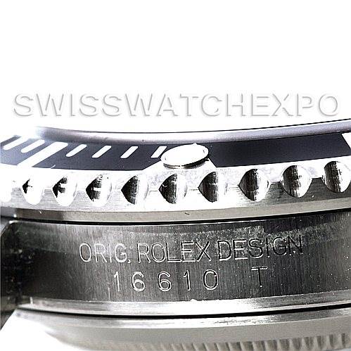 The image shows a close-up side angle of the Rolex Submariner 16610 Men
s Stainless Steel Black Dial 16610 Men
s Stainless Steel Black Dial
s bezel and case, including the engraving "ORIG. ROLEX DESIGN 16610 T."