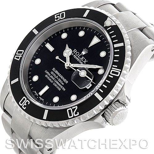 This image shows a close-up of the face and part of the bracelet of a Rolex Submariner 16610 Men
s Stainless Steel Black Dial 16610 Men
s Stainless Steel Black Dial, viewed from an angled perspective.