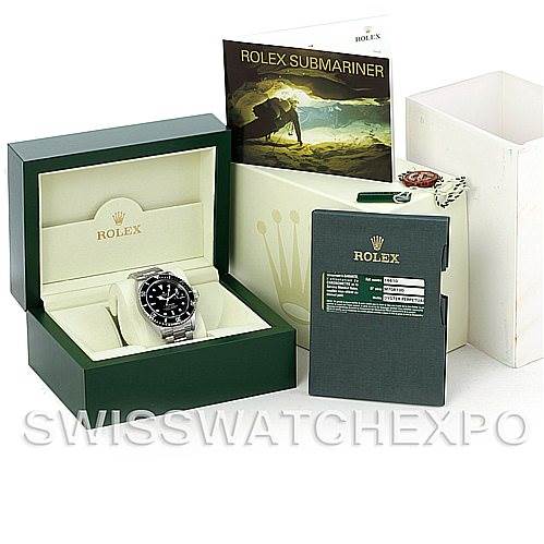 The image shows a Rolex Submariner 16610 Men
s Stainless Steel Black Dial 16610 Men
s Stainless Steel Black Dial watch with its open green box, manual, warranty card, and outer box packaging.