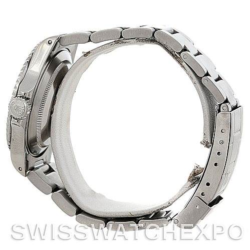 The image shows a side view of a Rolex Submariner 14060 Men
s Stainless Steel Black Dial 14060 Men
s Stainless Steel Black Dial watch highlighting the bracelet and clasp.