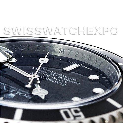The image shows a close-up angle of the Rolex Submariner 16610 Men
s Stainless Steel Black Dial 16610 Men
s Stainless Steel Black Dial watch, focusing on the dial, bezel, and serial number inside the rehaut.