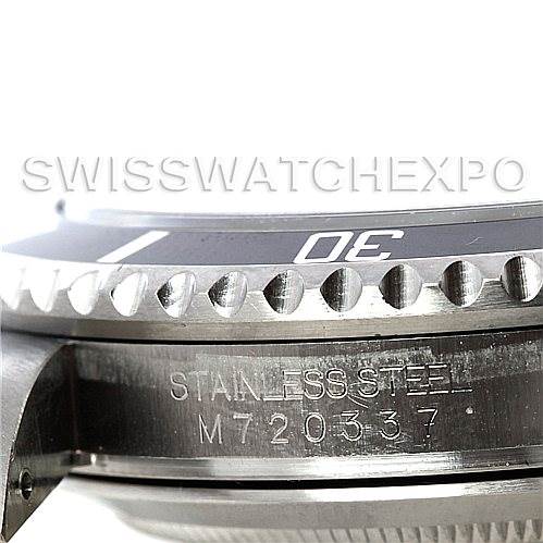 This image shows a close-up side view of a Rolex Submariner 16610 Men
s Stainless Steel Black Dial 16610 Men
s Stainless Steel Black Dial, highlighting the bezel, part of the dial, and the serial number engraving.