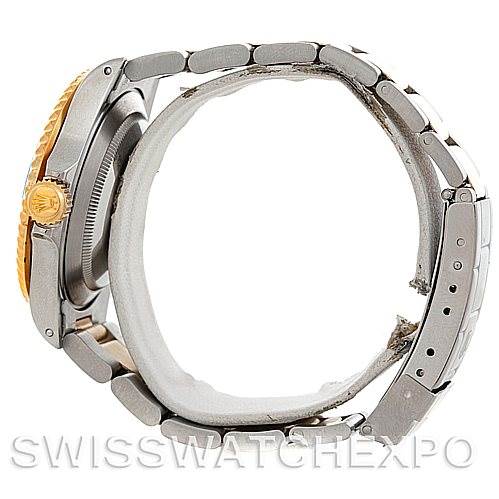 This image shows the side view of a Rolex Submariner 16613 Men
s Steel and Gold (two tone) Black Dial 16613 Men
s Steel and Gold (two tone) Black Dial watch, highlighting the bracelet and the crown.