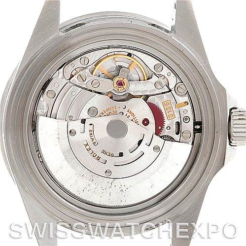 The image shows the back view of a Rolex Submariner 16610 Men
s Stainless Steel Black Dial 16610 Men
s Stainless Steel Black Dial watch, focusing on its internal mechanism and movement parts.