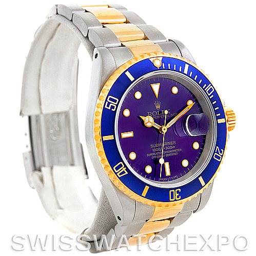 This Rolex Submariner 16613 Men's Steel and Gold (two tone) Blue Dial 16613 Men's Steel and Gold (two tone) Blue Dial is shown from a front-left angle displaying its two-tone bracelet, blue bezel, and dial.