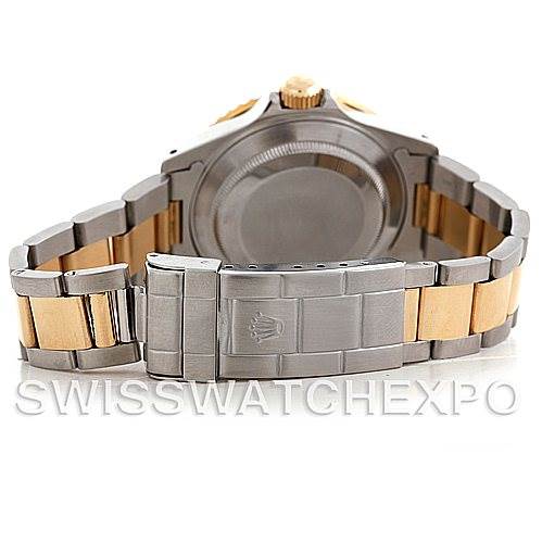 The image shows the back and clasp of a Rolex Submariner 16613 Men's Steel and Gold (two tone) Blue Dial 16613 Men's Steel and Gold (two tone) Blue Dial watch, highlighting its two-tone metal bracelet.