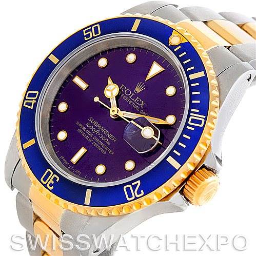 The image shows a Rolex Submariner 16613 Men's Steel and Gold (two tone) Blue Dial 16613 Men's Steel and Gold (two tone) Blue Dial watch at an oblique angle, highlighting the bezel, dial, crown, and part of the bracelet.