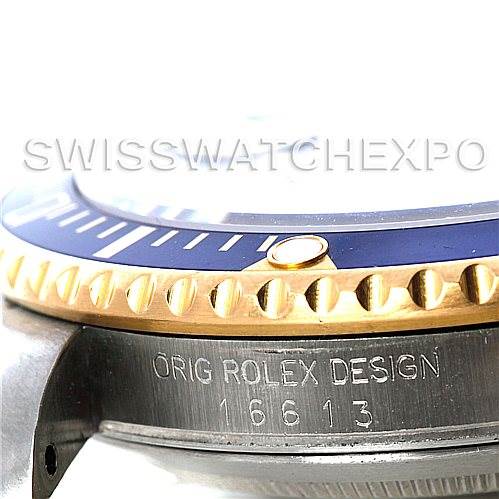 The image shows a close-up side view of the Rolex Submariner 16613 Men's Steel and Gold (two tone) Blue Dial 16613 Men's Steel and Gold (two tone) Blue Dial's bezel, crown guard, and engravings on the case.
