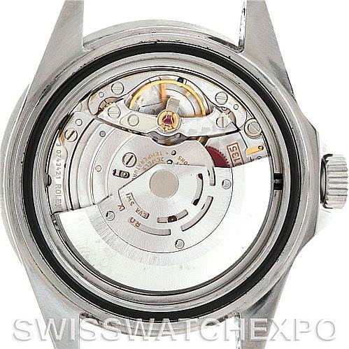 This image shows the inner mechanism of a Rolex Submariner 16610 Men
s Stainless Steel Black Dial 16610 Men
s Stainless Steel Black Dial watch viewed from the back, displaying its intricate parts.