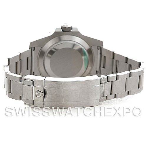 This image shows the back and bracelet of a Rolex Submariner 116610 Men's Stainless Steel Green Dial 116610 Men's Stainless Steel Green Dial watch from an overhead angle.