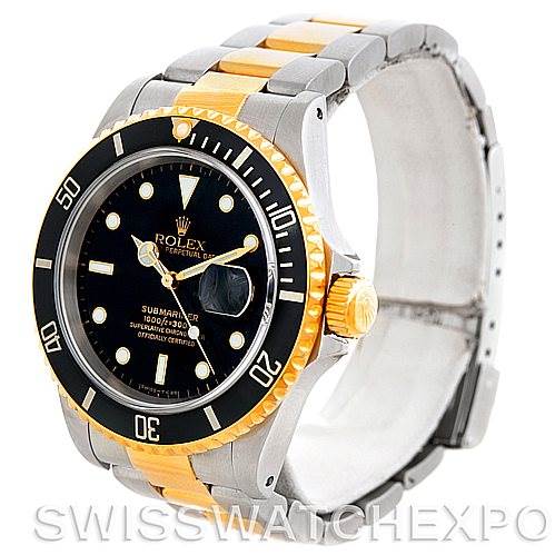 The image shows a Rolex Submariner 16613 Men's Steel and Gold (two tone) Black Dial 16613 Men's Steel and Gold (two tone) Black Dial watch at a slightly angled view, highlighting its black dial, gold bezel, and two-tone bracelet.