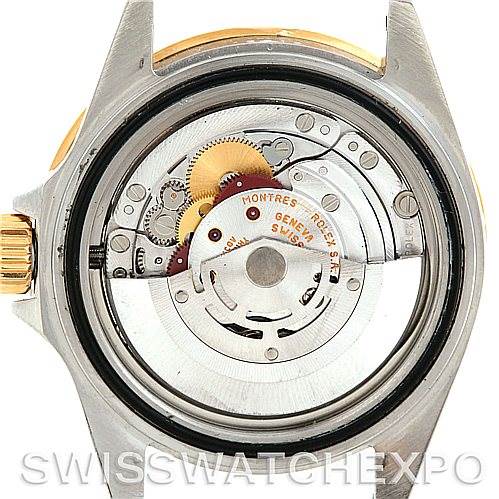 This image shows the back view of a Rolex Submariner 16613 Men's Steel and Gold (two tone) Black Dial 16613 Men's Steel and Gold (two tone) Black Dial watch, focusing on its internal mechanism and movement components.