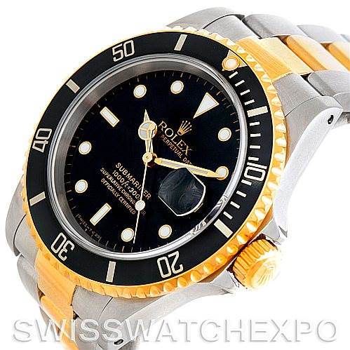 The image shows a Rolex Submariner 16613 Men's Steel and Gold (two tone) Black Dial 16613 Men's Steel and Gold (two tone) Black Dial model watch angled from the top right, highlighting the bezel, dial, and bracelet.