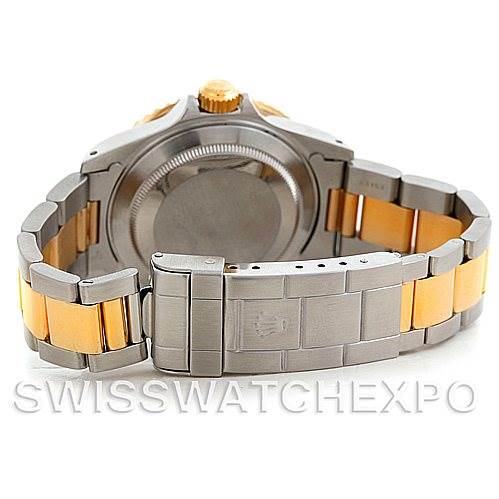 The image shows the back of the Rolex Submariner 16613 Men's Steel and Gold (two tone) Black Dial 16613 Men's Steel and Gold (two tone) Black Dial watch, highlighting its case, crown, and bracelet clasp.