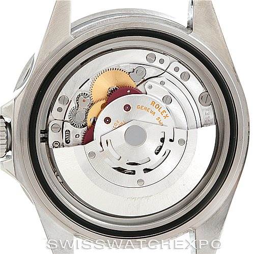 The image shows the back of a Rolex Submariner 16610LV Men
s Stainless Steel Black Dial 16610LV Men
s Stainless Steel Black Dial watch, specifically highlighting the movement and internal components.