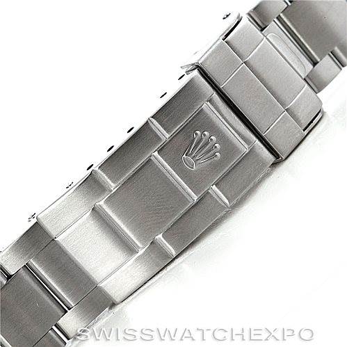 This image shows the clasp of a Rolex Submariner 16610LV Men
s Stainless Steel Black Dial 16610LV Men
s Stainless Steel Black Dial watch
s stainless steel bracelet from an angled side view.