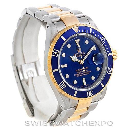 This image shows a Rolex Submariner 16613 Men's Steel and Gold (two tone) Blue Dial 16613 Men's Steel and Gold (two tone) Blue Dial watch at a slight angle from the front, highlighting the blue dial, bezel, and two-tone metal bracelet.
