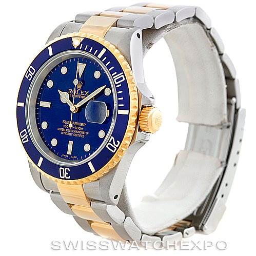 The image shows a side angle of the Rolex Submariner 16613 Men's Steel and Gold (two tone) Blue Dial 16613 Men's Steel and Gold (two tone) Blue Dial watch, focusing on its blue dial, two-tone bracelet, and bezel.