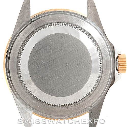 This image shows the back case and crown of a Rolex Submariner 16613 Men's Steel and Gold (two tone) Blue Dial 16613 Men's Steel and Gold (two tone) Blue Dial watch.