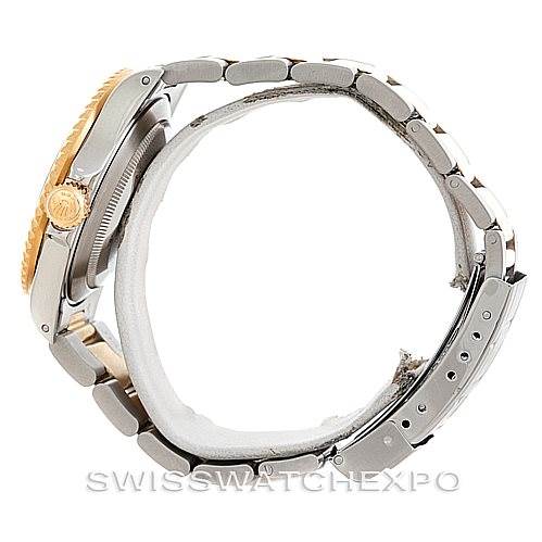 This side-view image shows the case, crown, and bracelet of a Rolex Submariner 16613 Men's Steel and Gold (two tone) Blue Dial 16613 Men's Steel and Gold (two tone) Blue Dial watch.