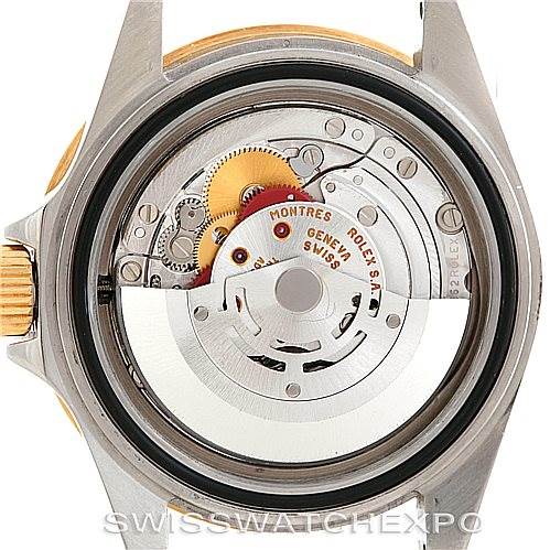This image shows the back of the Rolex Submariner 16613 Men's Steel and Gold (two tone) Blue Dial 16613 Men's Steel and Gold (two tone) Blue Dial watch, revealing the internal mechanical movement and components.