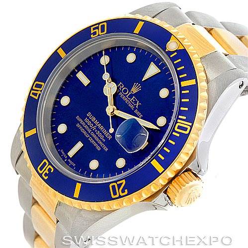 This image shows a Rolex Submariner 16613 Men's Steel and Gold (two tone) Blue Dial 16613 Men's Steel and Gold (two tone) Blue Dial watch at a slight angle, displaying the face, bezel, and part of the bracelet.