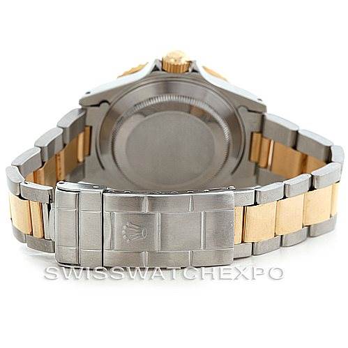 The image shows the back side and bracelet of a Rolex Submariner 16613 Men's Steel and Gold (two tone) Blue Dial 16613 Men's Steel and Gold (two tone) Blue Dial watch, highlighting its clasp and caseback.