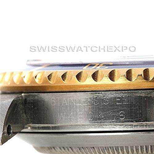 The image shows a close-up side view of the Rolex Submariner 16613 Men's Steel and Gold (two tone) Blue Dial 16613 Men's Steel and Gold (two tone) Blue Dial watch case and bezel, highlighting the stainless steel engraving.