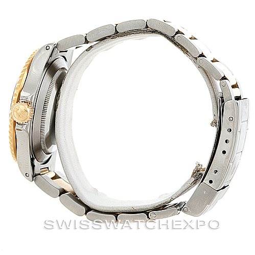 This is a side view of the Rolex Submariner 16613 Men's Steel and Gold (two tone) Blue Dial 16613 Men's Steel and Gold (two tone) Blue Dial watch, showing the case, crown, and bracelet.