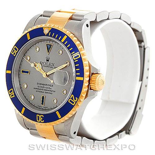 This image shows a front angled view of a Rolex Submariner 16613 Men
s Steel and Gold (two tone) Grey Dial 16613 Men
s Steel and Gold (two tone) Grey Dial watch, displaying the dial, bezel, and part of the bracelet.