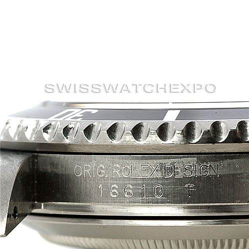 The image shows the side view of a Rolex Submariner 16610 Men
s Stainless Steel Black Dial 16610 Men
s Stainless Steel Black Dial model, capturing the bezel, lugs, and part of the case with engravings.