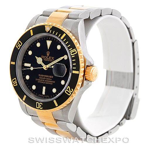 The Rolex Submariner 16613 Men's Steel and Gold (two tone) Black Dial 16613 Men's Steel and Gold (two tone) Black Dial watch is shown at a three-quarter angle displaying the black dial, two-tone bezel, crown, and bracelet.