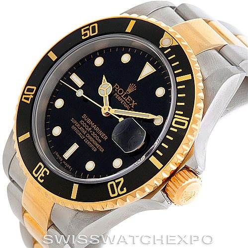 This image shows a Rolex Submariner 16613 Men's Steel and Gold (two tone) Black Dial 16613 Men's Steel and Gold (two tone) Black Dial watch from an angled view, highlighting the dial, bezel, crown, and two-tone bracelet.