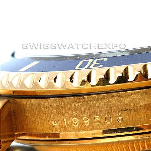 The image shows a close-up of the side of the Rolex Submariner 16618 Men's Yellow Gold Blue Dial 16618 Men's Yellow Gold Blue Dial watch, focusing on the bezel and part of the case with serial number A199506.