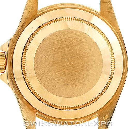 This image shows the case back of a Rolex Submariner 16618 Men's Yellow Gold Blue Dial 16618 Men's Yellow Gold Blue Dial watch, highlighting the screw-down back and crown.