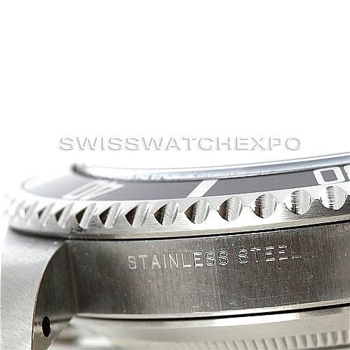 This close-up angle of the Rolex Submariner 14060 Men
s Stainless Steel Black Dial 14060 Men
s Stainless Steel Black Dial shows the stainless steel bezel and part of the case.