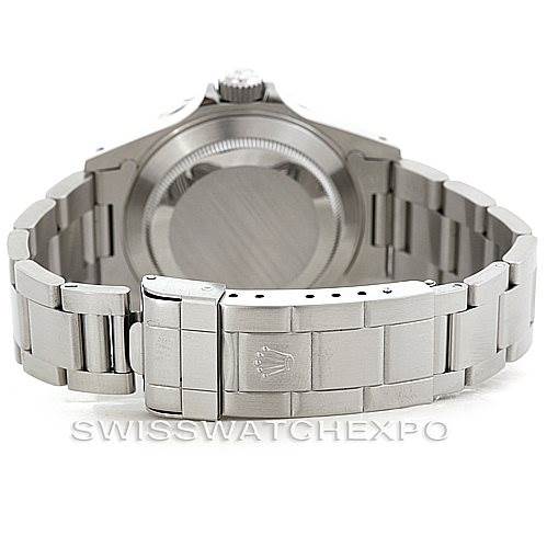 The image shows the rear view of a Rolex Submariner 14060 Men
s Stainless Steel Black Dial 14060 Men
s Stainless Steel Black Dial watch, highlighting its stainless steel bracelet and clasp.